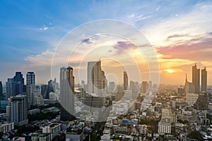 Cityscape of modern buildings and urban architecture. Aerial view of Bangkok city at twilight sunset in Thailand