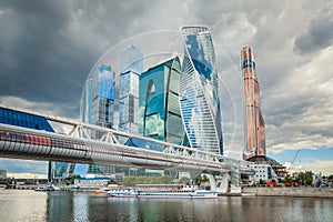 Cityscape of modern skyscrapers in Russia. The Moscow City on a cloudy summer day.