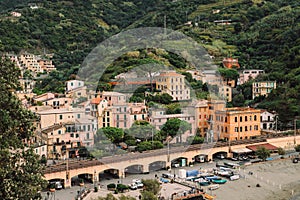 Cityscape of Monterosso al Mare with picturesque green hills on the background, Five lands, Italy