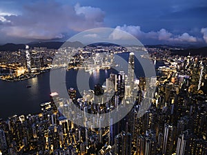 Cityscape night view of Hong Kong island, drone aerial high angle view. Skyscraper buildings in financial district