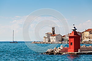 Cityscape of the old city Piran with medieval and new lighthouses