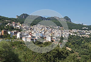 Cityscape of old pictoresque colorful village Jerzu with limestone rocks, mountains and green forest vegetation. Summer