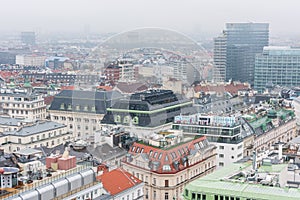 Cityscape of the old town of Vienna in a heavy snowy day.  View at the tower of St. Stephen`s Cathedral in Vienna, Austria