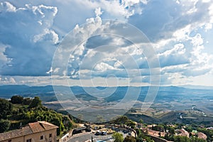 Cityscape over the roofs and surrounding landscape, a view from bell tower at Piazza dei Priori in Volterra, Tuscany