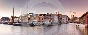 Cityscape, panorama, banner - view of city channel with ships, the city of Leiden photo