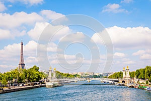 Cityscape of the river Seine in Paris, France, with the pont Alexandre III and the Eiffel tower by a sunny day