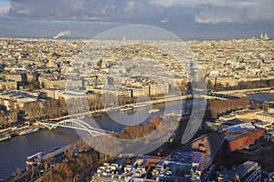 Cityscape of Paris, shadow from the Eiffel Tower visible on the picture.