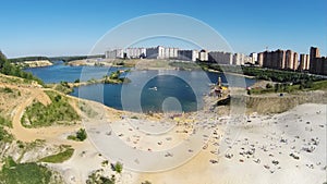 Cityscape with people get rest on sand beach near photo