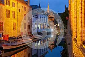 Cityscape with the picturesque night canal Dijver in Bruges