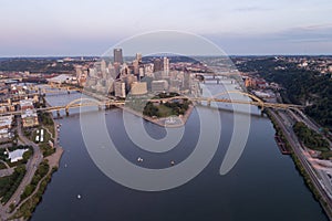 Cityscape of Pittsburgh  in the evening.  Point State Park Fountain in background