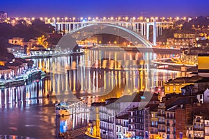 Cityscape of Porto and Arrabida Bridge Ponte da ArrÃ¡bida at night, Valley of The Douro River, Portugal