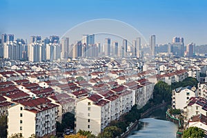 Cityscape of residential house rooftop and skyscraper