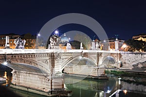 Cityscape romantic night view of Roma. Panorama with Saint Peter\'s basilica and Saint Angelo castle and bridge