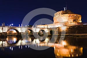 Cityscape romantic night view of Roma. Panorama with Saint Peter\'s basilica and Saint Angelo castle and bridge.