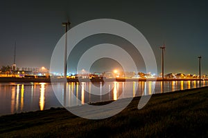 Cityscape of Rotterdam Port in Misty Night under Radiant Lights