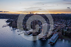 Cityscape of Seattle surrounded by the sea in the evening