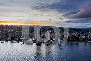 Cityscape of Seattle surrounded by the sea in the evening