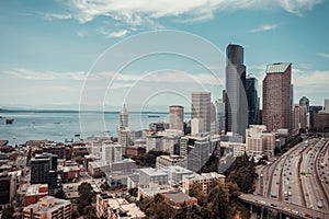 Cityscape of Seattle surrounded by the sea under the sunlight