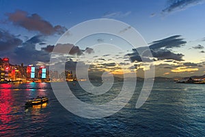 Cityscape and skyline at Victoria Harbour at twilight time. Popular view point of Hong Kong city at sunset time