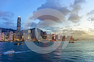 Cityscape and skyline at Victoria Harbour at twilight time. Popular view point of Hong Kong city at sunset time