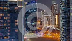 Cityscape of skyscrapers in Dubai Business Bay aerial night timelapse