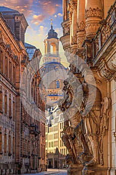 Cityscape - street view with sculptures of gatekeepers on the George Gate of Dresden Castle