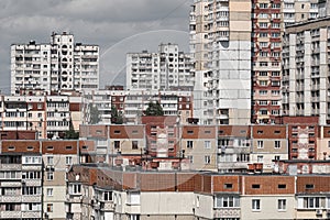 Cityscape of a stuffy post-Soviet city, densely built up with multi-storey residential panel buildings