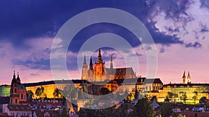 Cityscape at sunset - view of the historical district of Hradcany with the castle complex Prague Castle