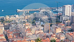 Cityscape timelapse of Monte Carlo, Monaco with roofs of buildings during summer sunset.