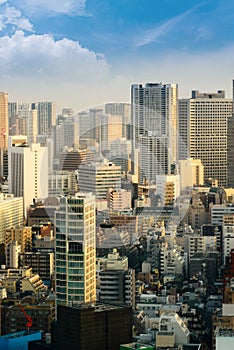 cityscape of tokyo city skyline in Aerial view with skyscraper, modern business office building with blue sky background in Tokyo