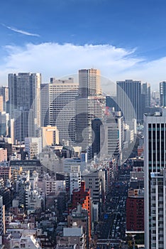 Cityscape of tokyo city skyline in Aerial view with skyscraper, modern office building and blue sky background in Tokyo metropolis