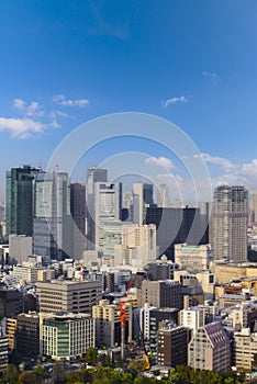 Cityscape of Tokyo city, view from aerial skyscraper, office building and downtown and street of tokyo with blue sky background.