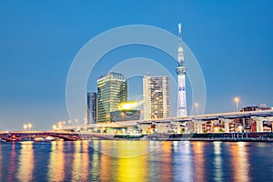 Cityscape of Tokyo skyline, panorama view of office building at Sumida river in Tokyo in the evening.