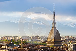 Cityscape of Torino (Turin, Italy) at sunset with storm clouds