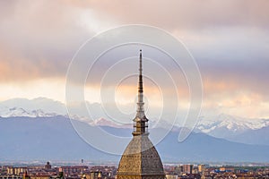 Cityscape of Torino (Turin, Italy) at sunset with storm clouds