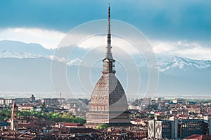 Cityscape of Torino (Turin, Italy) at sunset with storm clouds