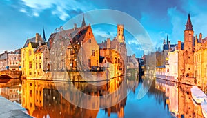 Cityscape with a tower Belfort from Rozenhoedkaai in Bruges at s