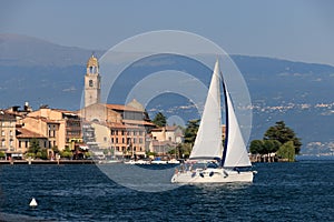 Salo at Lake Garda, Italy with a boat crossing photo