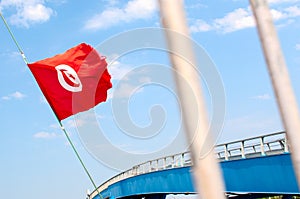 Cityscape with Tunisia flag, bridge and bars