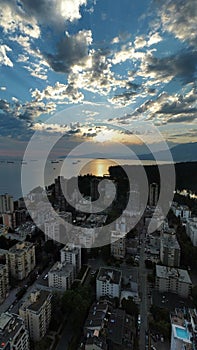 Cityscape of Vancouver against the background of the cloudy sky at sunset. British Columbia, Canada.