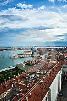 A cityscape of Venice, view of picturesque old buildings and Santa Maria della Salute Cathedral from the bell tower at Saint Mark