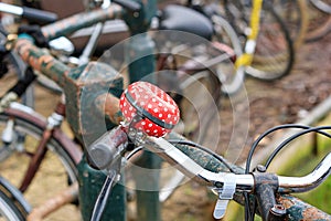 Cityscape - view of the bicycle bell on the handlebars close-up, bicycle parking