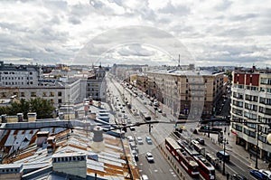 Cityscape - view of the city avenue. buildings and infrastructure, cars and pedestrians. autumn weather in the city.