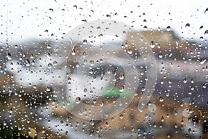 Cityscape View With Differential Focus Though Rain Soaked Window