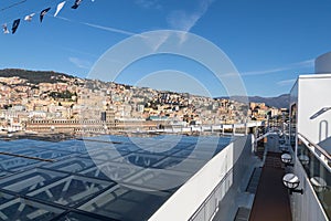 Cityscape view of Genoa from upper deck of cruise liner