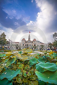 Cityscape view of HoChiMinh City People`s Committee and Nguyen Hue Walking Street , Vietnam with blue sky at sunset