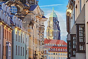Cityscape - view of the old street of Dresden against the backdrop of the Dresden Town Hall or the City Council of Dresden