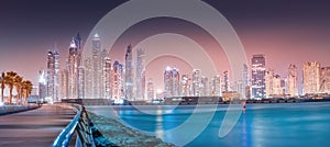 Cityscape view of skyscrapers and hotel buildings in the Dubai Marina area from the palm Jumeirah island in Dubai. Real