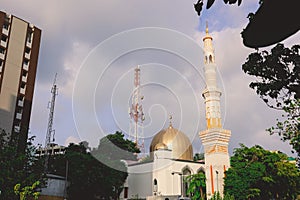 Cityscape View to the White and Golden Minaret and Dome of the largest Grand Friday Mosque in Maldives