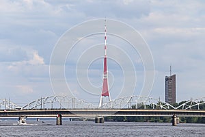 Cityscape view of transportation bridges over river Daugava and TV tower in background